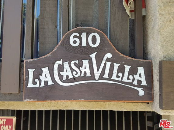 Sign reading 'La Casa Villa' with the number 610, attached to a building facade.