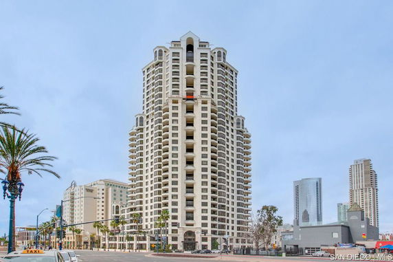 Front view of a multi-story building with balconies.