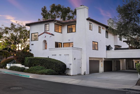 Front view of a multi-story house with an attached garage.