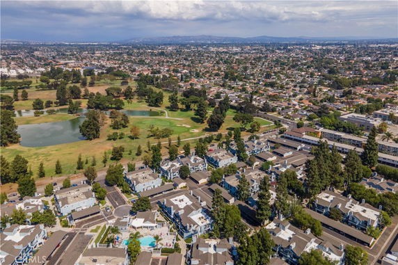 Aerial view of residential area and surrounding landscape.
