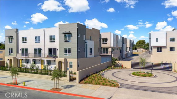 Front view of a modern multi-story apartment complex.