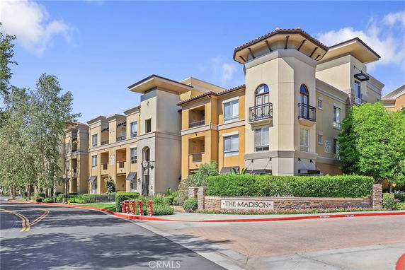 Front view of a multi-story apartment building named 'The Madison'.