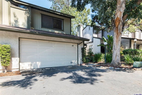 Front view of a two-story house with an attached garage.