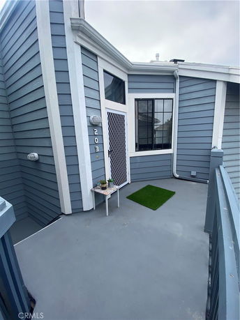Front view of a house entrance with a small porch area.