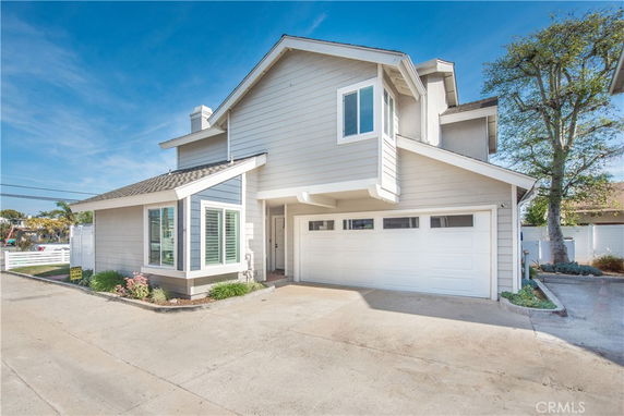 Front view of a two-story house with a double garage.