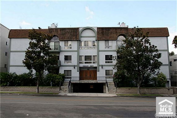 Front view of a multi-story building with symmetrical design.
