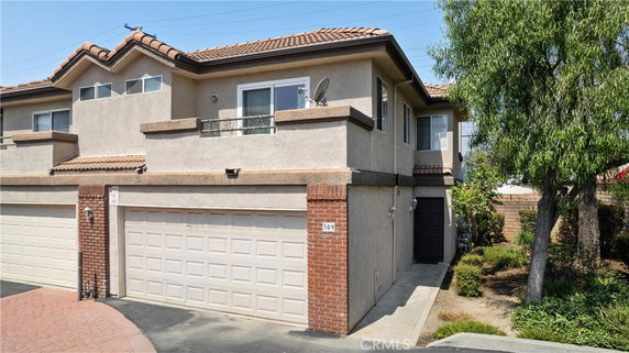 Front view of a two-story house with a double garage.