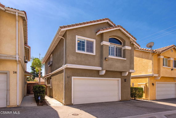 Front view of a two-story house with a double garage.
