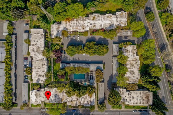 Aerial view of a residential complex with flat rooftops.