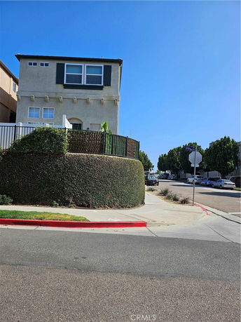 Front view of a two-story house on a corner lot.