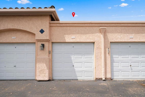 Front view of a building with multiple garage doors.