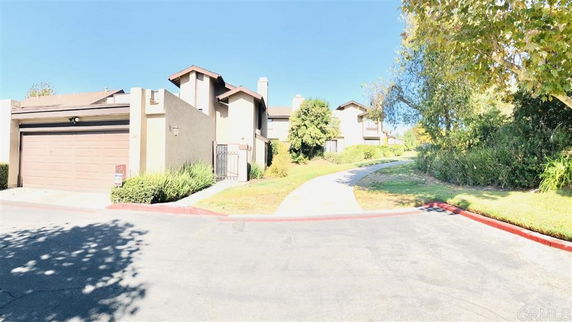 Front view of a multi-story house with a garage.