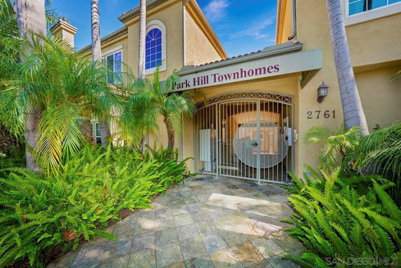 Front view of townhomes with gated entrance.