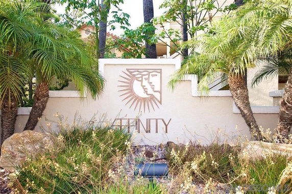 Front view of a building with decorative wall and logo
