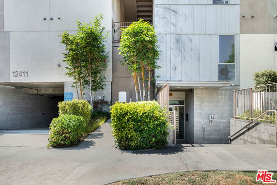 Front view of a modern multi-story building with minimalistic design.
