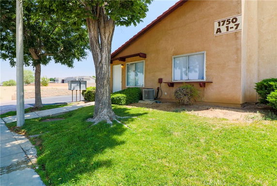 Front view of a single-story building with numbered signage.