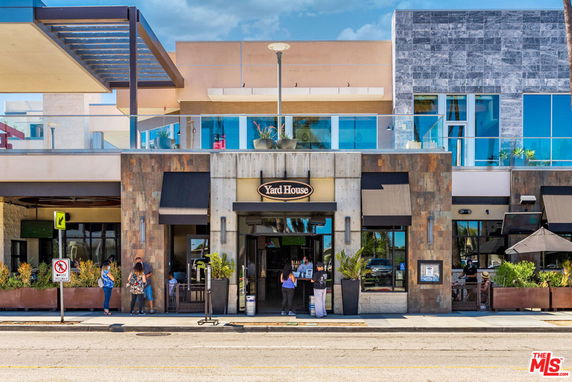Front view of a commercial building with a restaurant entrance.