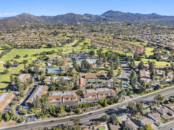 Wide view of a residential area with surrounding mountains.