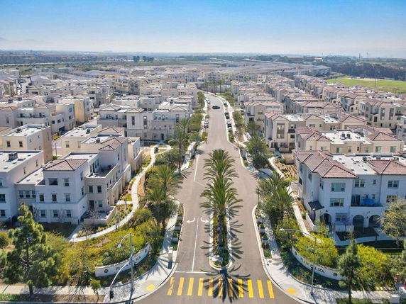Aerial view of a residential neighborhood with multiple multi-story houses.