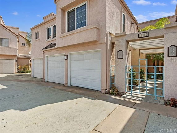 Front view of a multi-story house with a double garage.