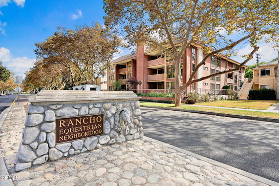 Front view of a multi-story residential building with balconies in the Rancho Equestrian Neighborhood.
