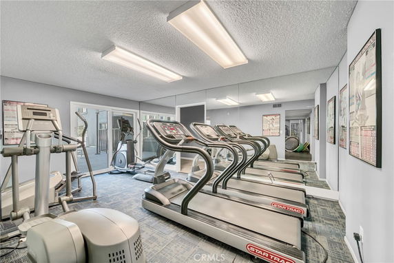 Indoor gym area with treadmills and exercise equipment.