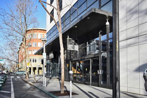 Front view of a modern commercial building with glass entrance.