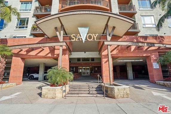 Front view of a multi-story building with a modern entrance.