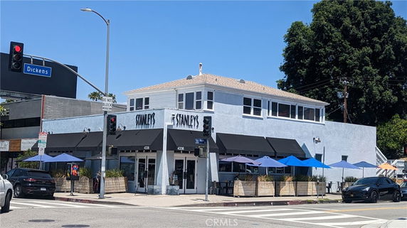Front view of a two-story commercial building with a restaurant on the ground floor.