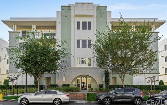 Front view of a multi-story residential building with a modern design.