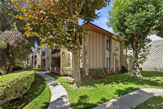 Front view of a two-story residential building with balconies.
