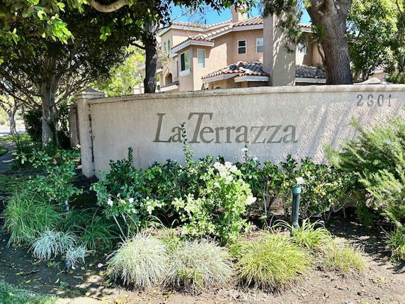 Front view of a residential complex with a large sign reading 'La Terrazza' on a wall.