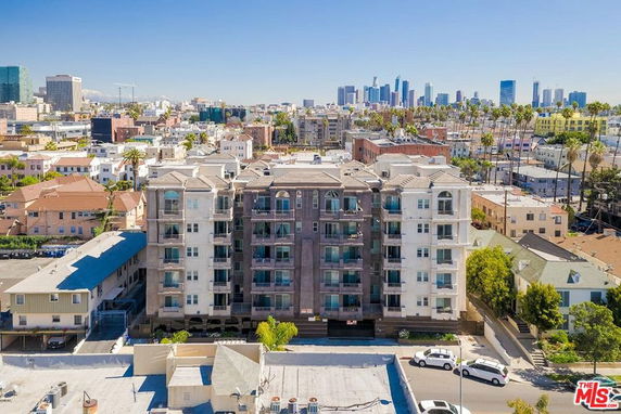 Front view of a multi-story apartment building in an urban area.