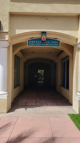 Front view of a building entrance with labeled archway