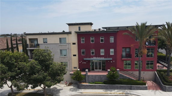 Front view of a multi-story building with modern design.