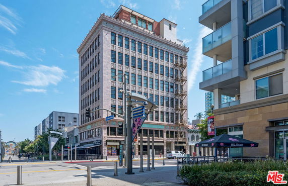 Front view of a multi-story building in an urban area.