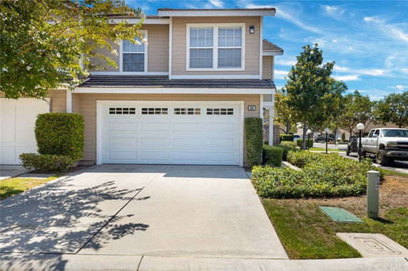 Front view of a two-story house with a double garage.