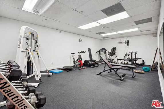 Indoor gym area with various exercise equipment.