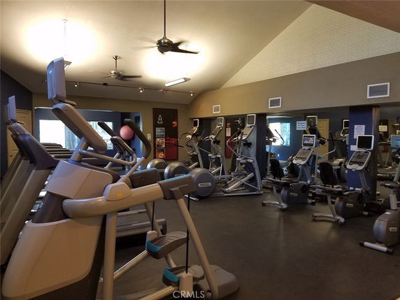 Interior view of a gym with various exercise equipment.