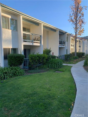 Front view of a two-story building with balconies