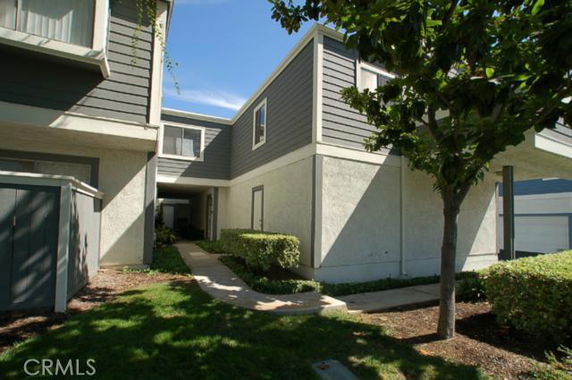 Front view of a two-story building with a connecting walkway.