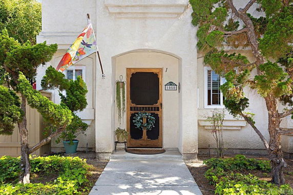 Front view of a house with an archway entrance.