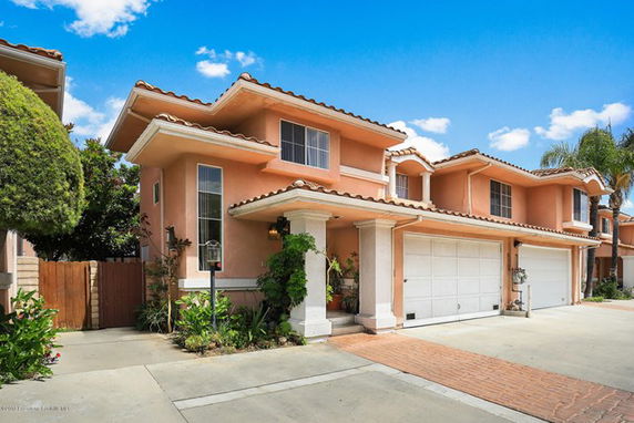 Front view of a two-story house with a double garage.