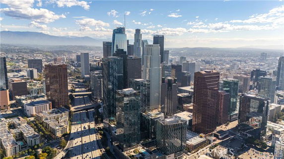 Panoramic view of a cityscape with numerous high-rise buildings.