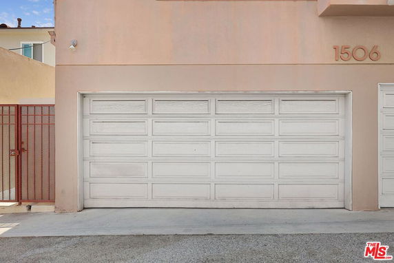 Front view of a house with a single-car garage door.