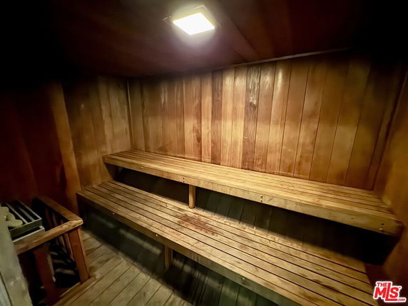 Interior of a wooden sauna with benches.