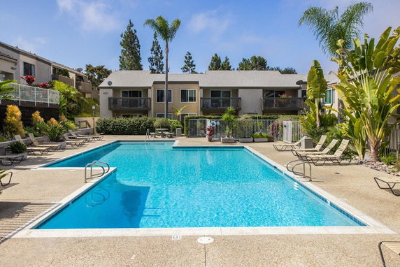 Outdoor swimming pool in front of residential buildings