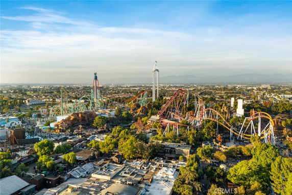 Aerial view of an amusement park with roller coasters and various rides.