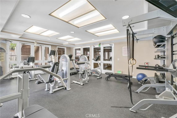 Indoor gym with various fitness equipment and machines.