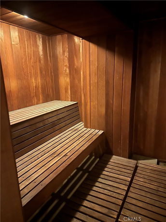Interior of a wooden sauna room with benches.